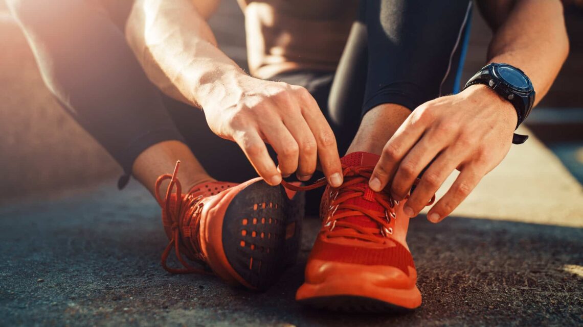 tying his shoe